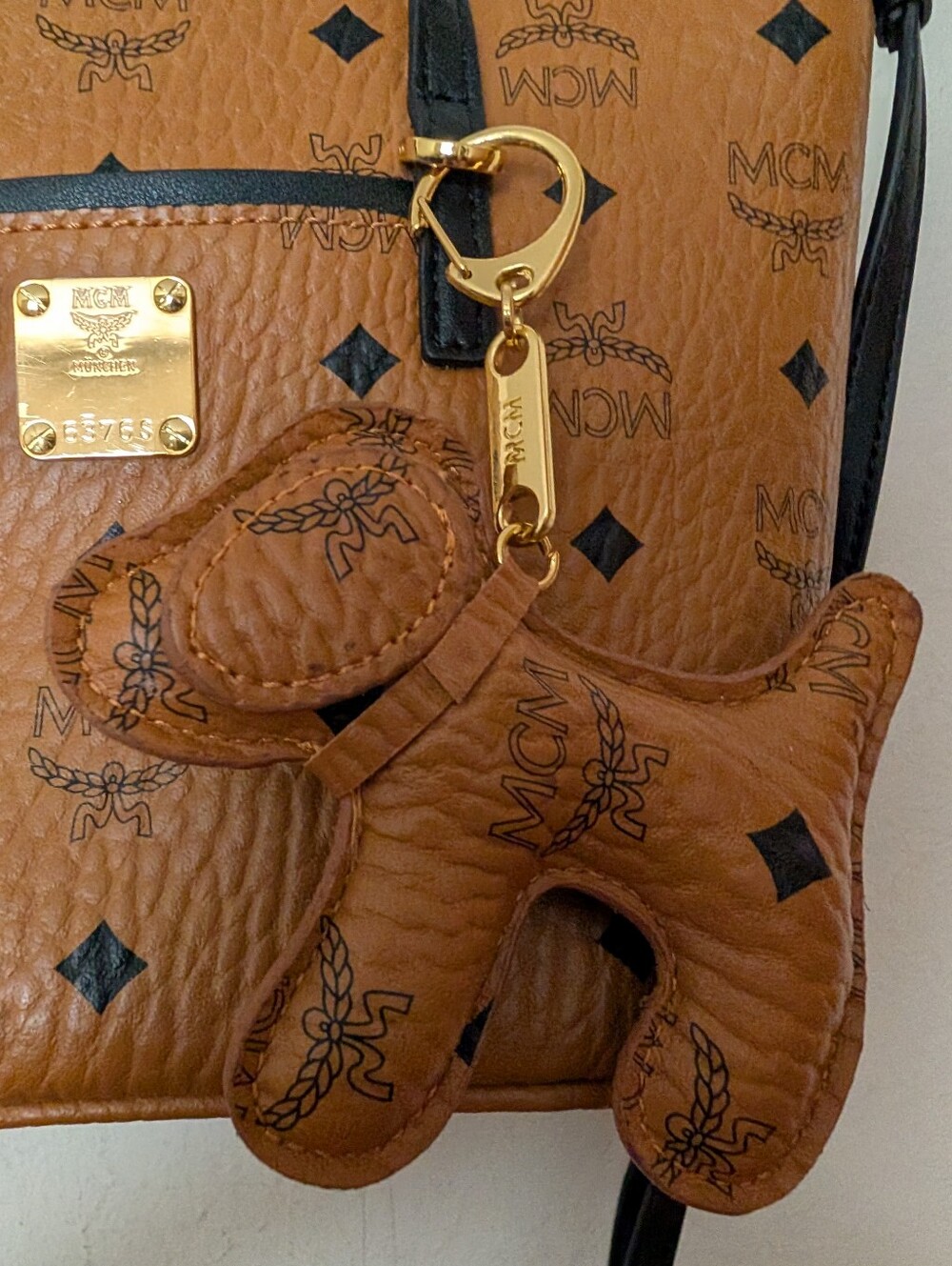 MCM Visetos Cognac Leather Mini Tote with Black Trim And Adorable Doggie Charm! - Picture 14 of 15